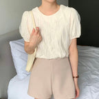 Wavy-patterned top with a bow tied at the back